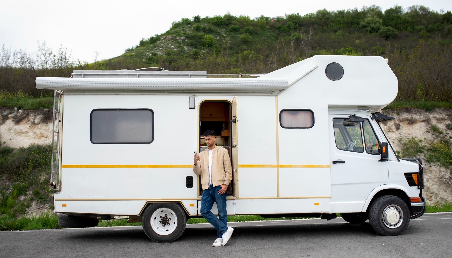 Man on phone outside of RV