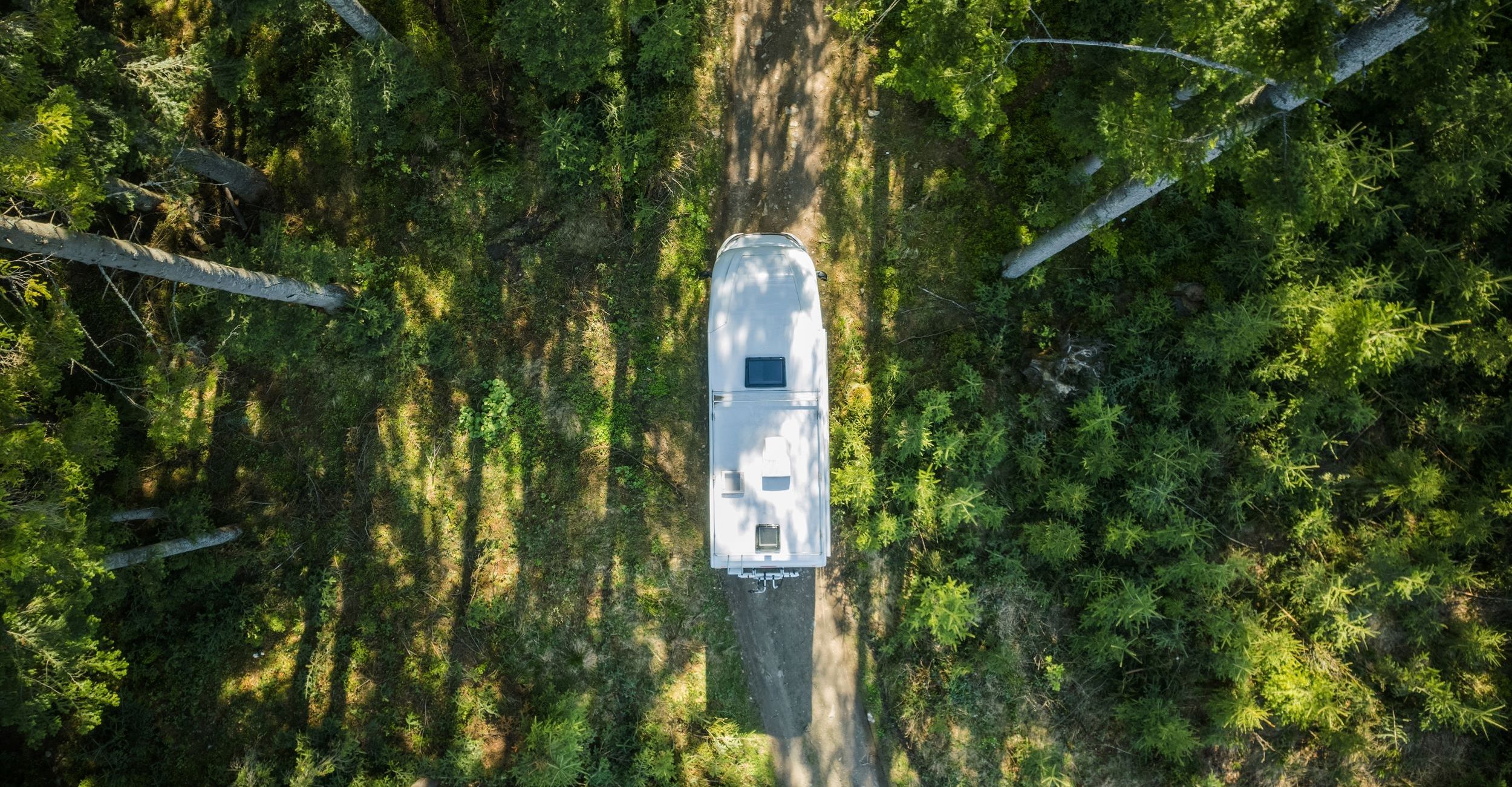 Man carrying tools into RV