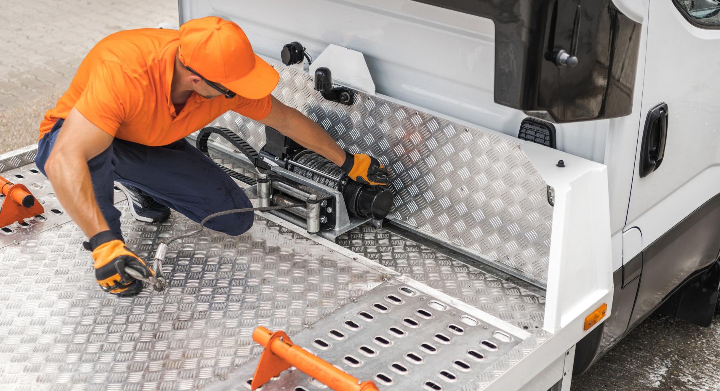 Man installing tow
rope on truck